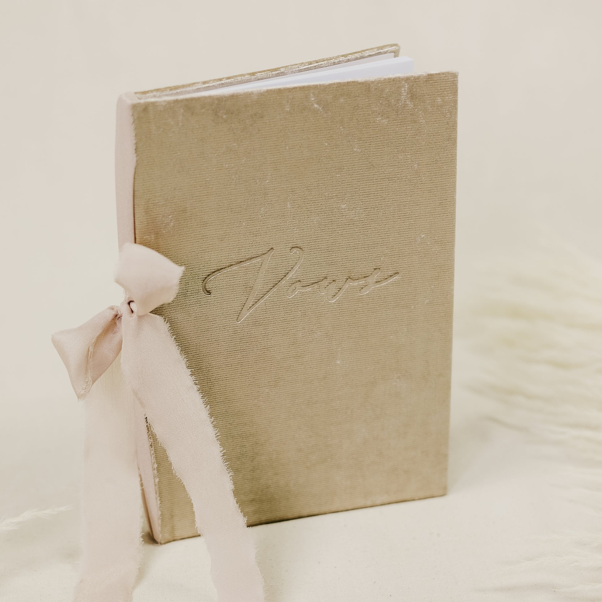 Vow book with a luxurious velvet cover, embossed with 'vows', and a wide selection of ribbon colors for the spine tie