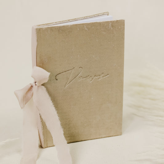 Vow book with a luxurious velvet cover, embossed with 'vows', and a wide selection of ribbon colors for the spine tie