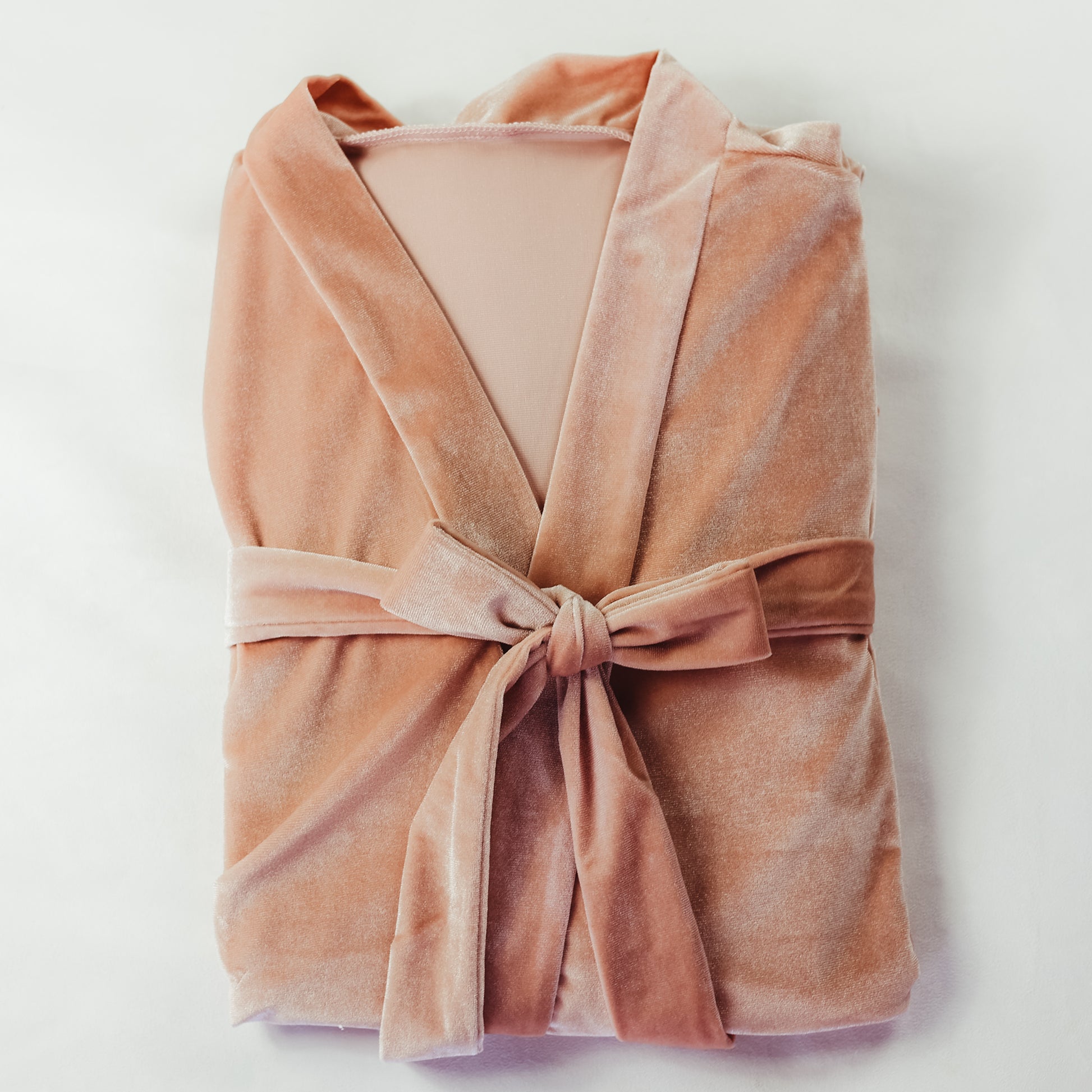 Blush-colored velvet bridesmaids robe with lace sleeve detail, one size fits all