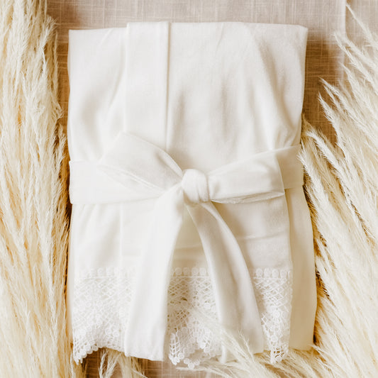 A beautiful velvet robe with lace sleeves, ideal for the bride to wear while preparing for her wedding.