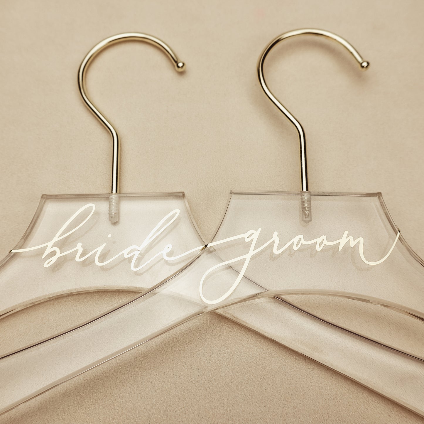 Champagne lettering on an acrylic hanger, a special keepsake for the bride's wedding day.