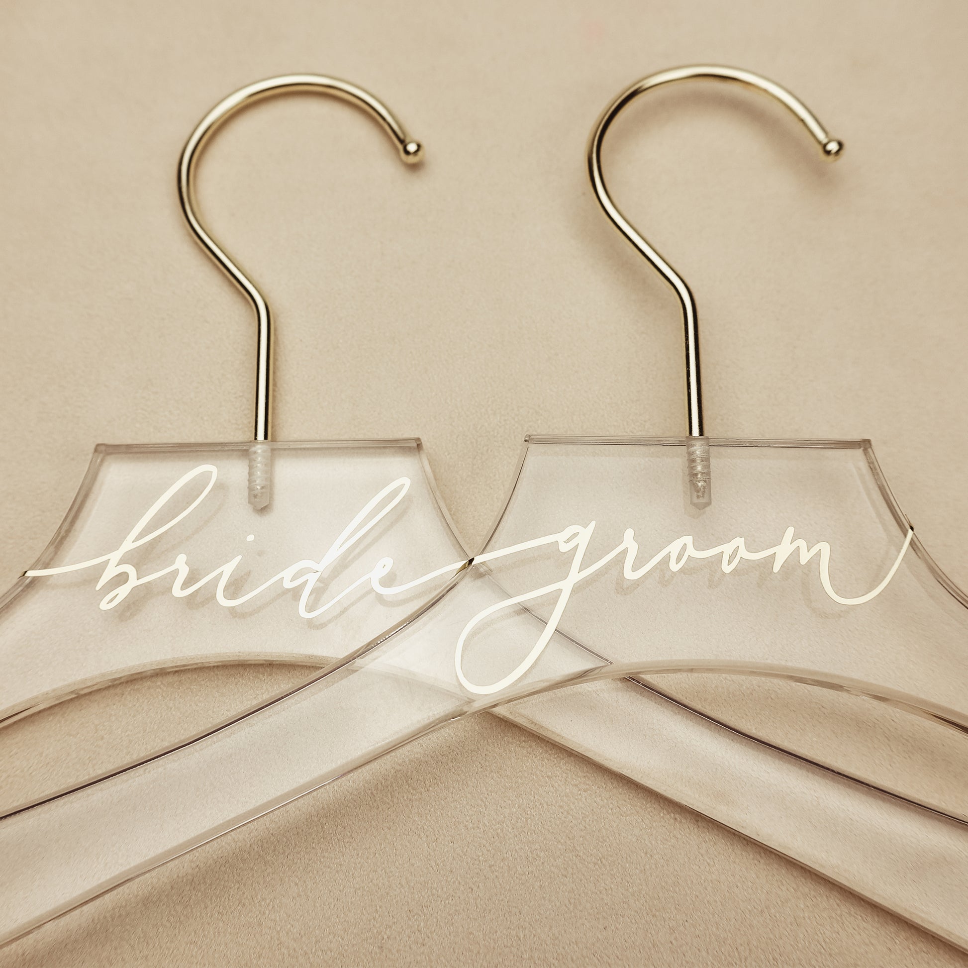 Champagne lettering on an acrylic hanger, a special keepsake for the bride's wedding day.