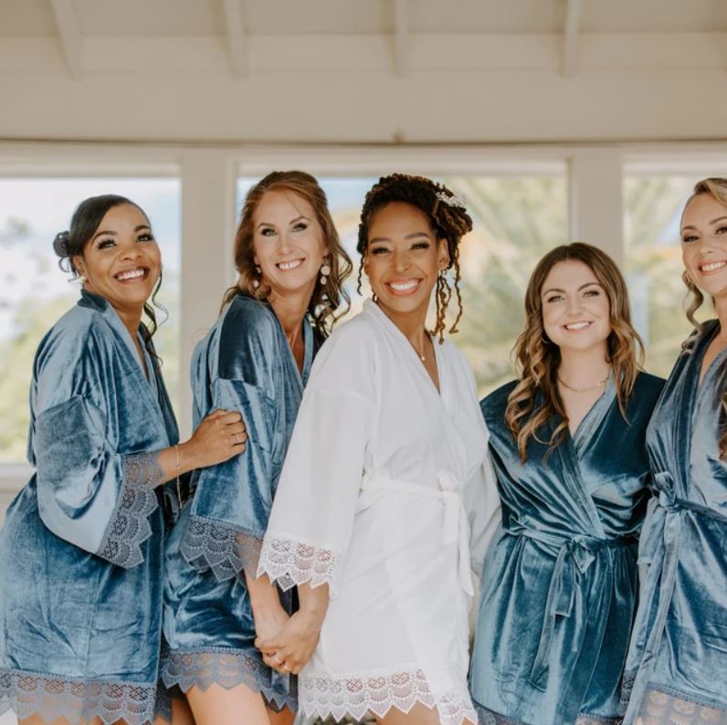 A truly decadent velvet bridesmaid robe, with lace sleeve embellishments, offering a spa-like experience