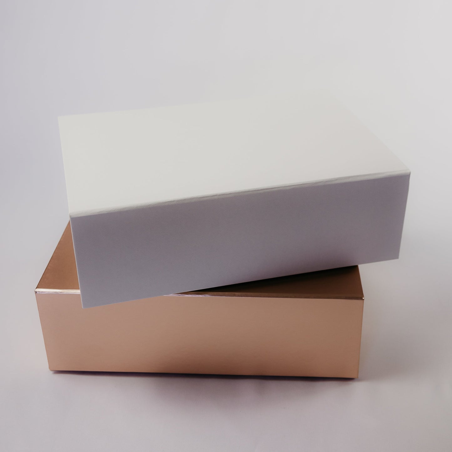 Examples of White and Rose Gold Gift Boxes Available for Personalization with Names in Calligraphy