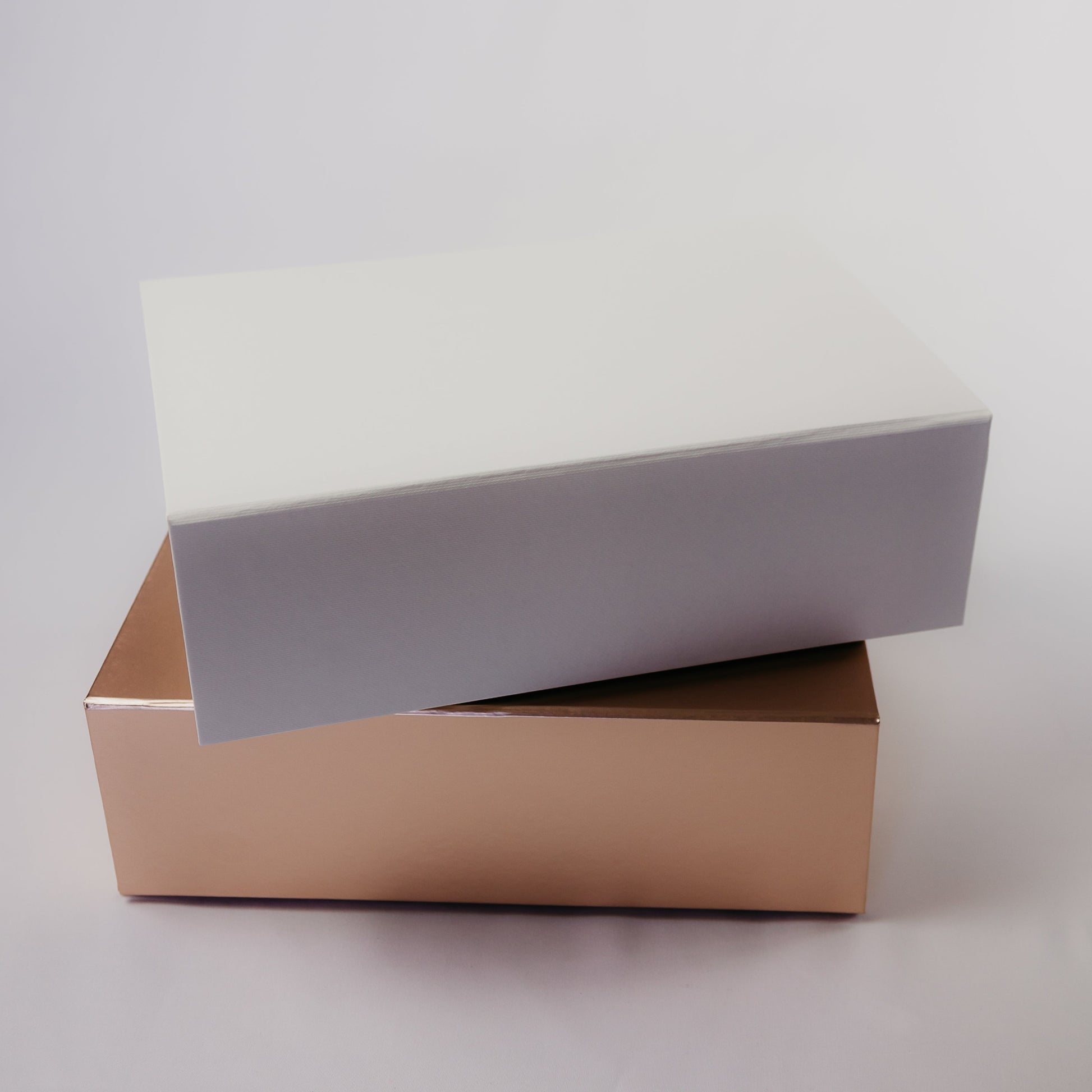 Examples of White and Rose Gold Gift Boxes Available for Personalization with Names in Calligraphy