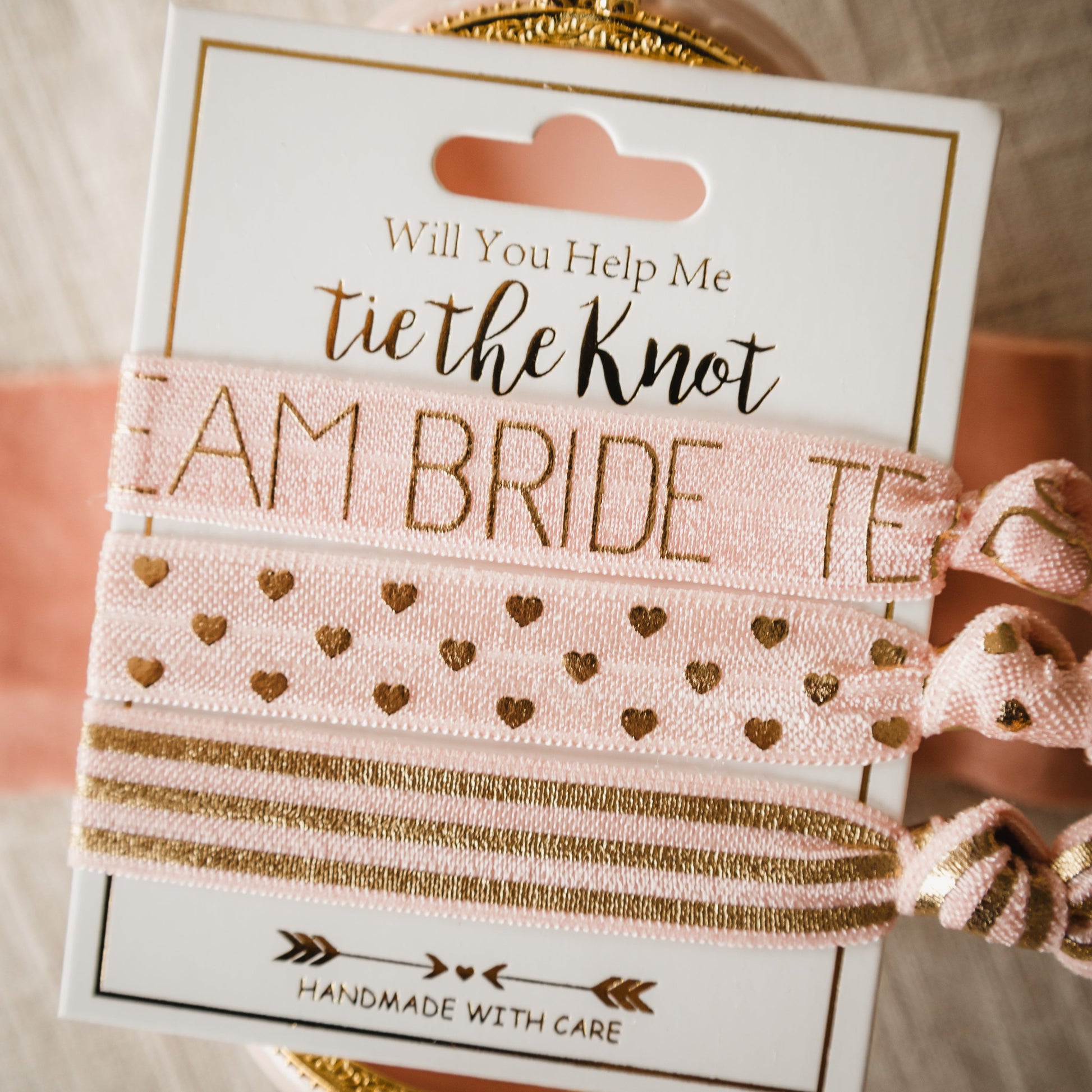 Gift your Bridesmaid with Something to Hold Their Hair Back as they Celebrate Team Bride