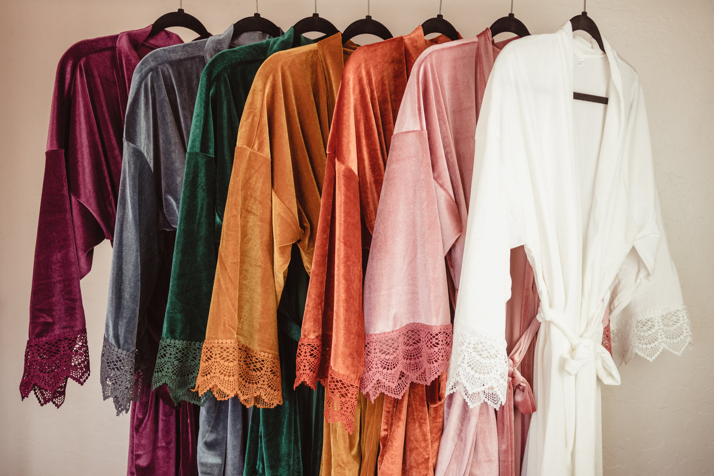 Elevate your bridal party's getting-ready experience with this luxurious velvet robe, adorned with delicate lace detailing