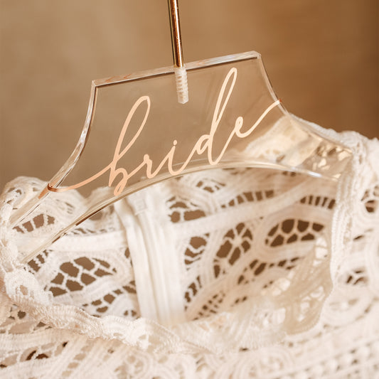 Personalized acrylic wedding dress hanger with gold name, a thoughtful gift for the bride