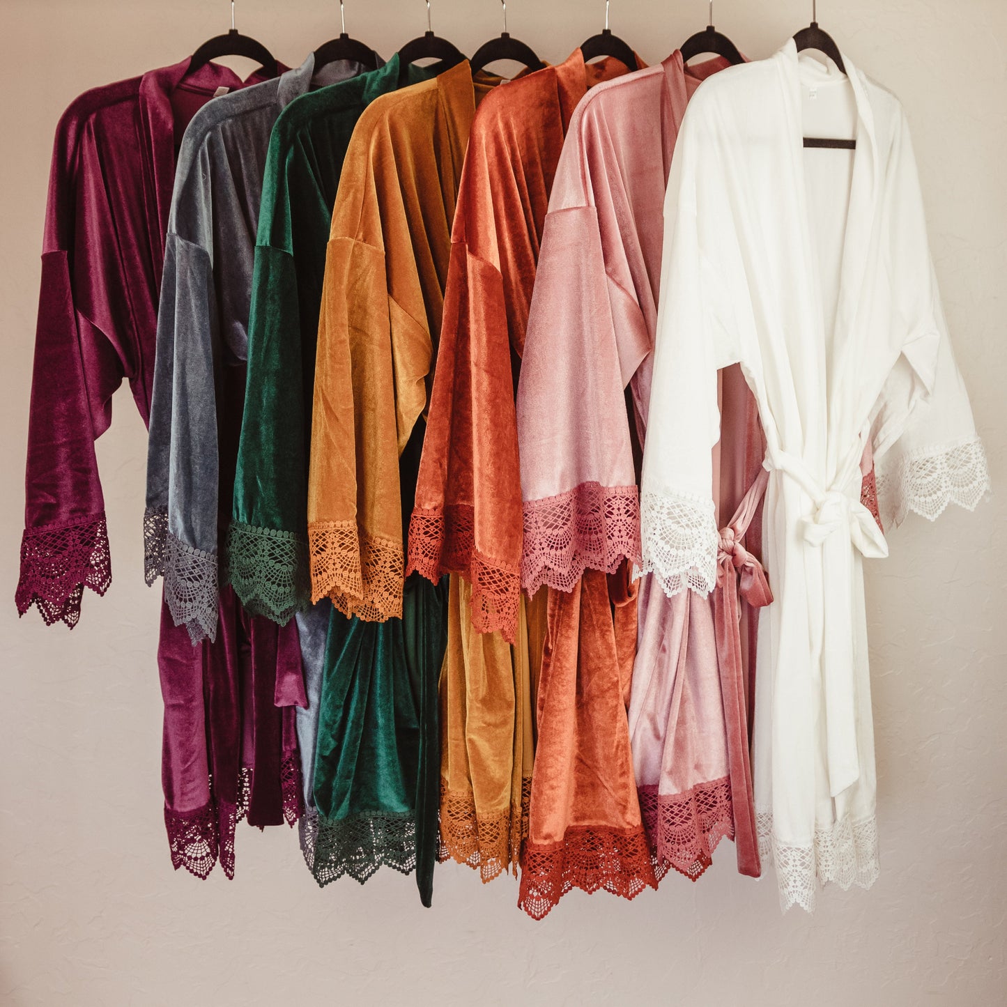 Experience the ultimate in comfort and luxury with this velvet robe, designed with delicate lace sleeves for a sophisticated touch
