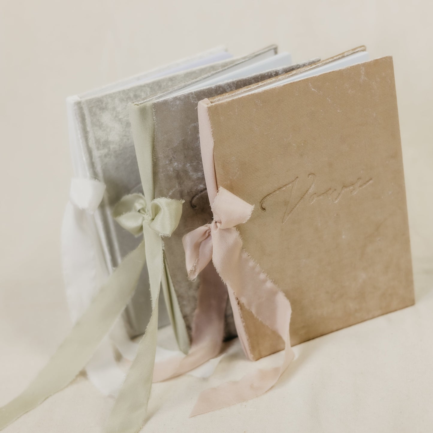 Vow book with a luxurious velvet cover, embossed with 'vows', and a wide selection of ribbon colors for the spine tie
