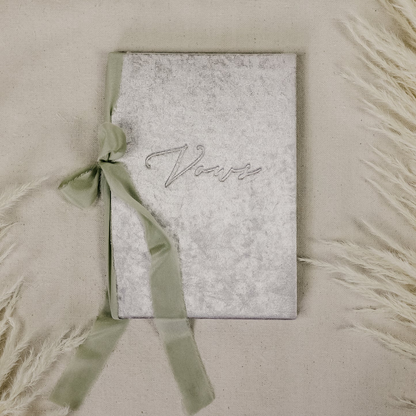 Write your wedding vows in a beautiful book covered with luxurious silver velvet