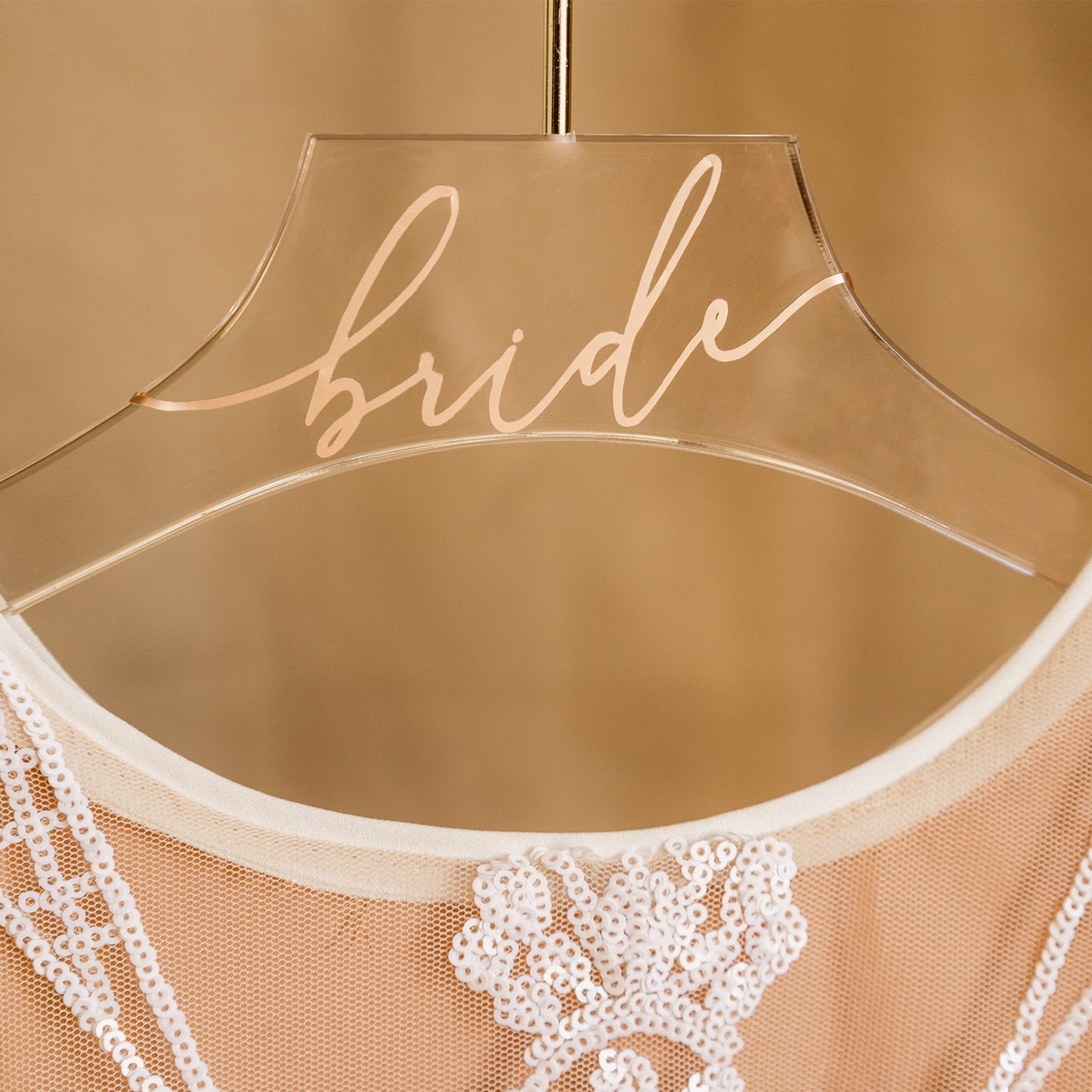 Bride's name on a clear acrylic hanger, a unique and personalized bridal shower present