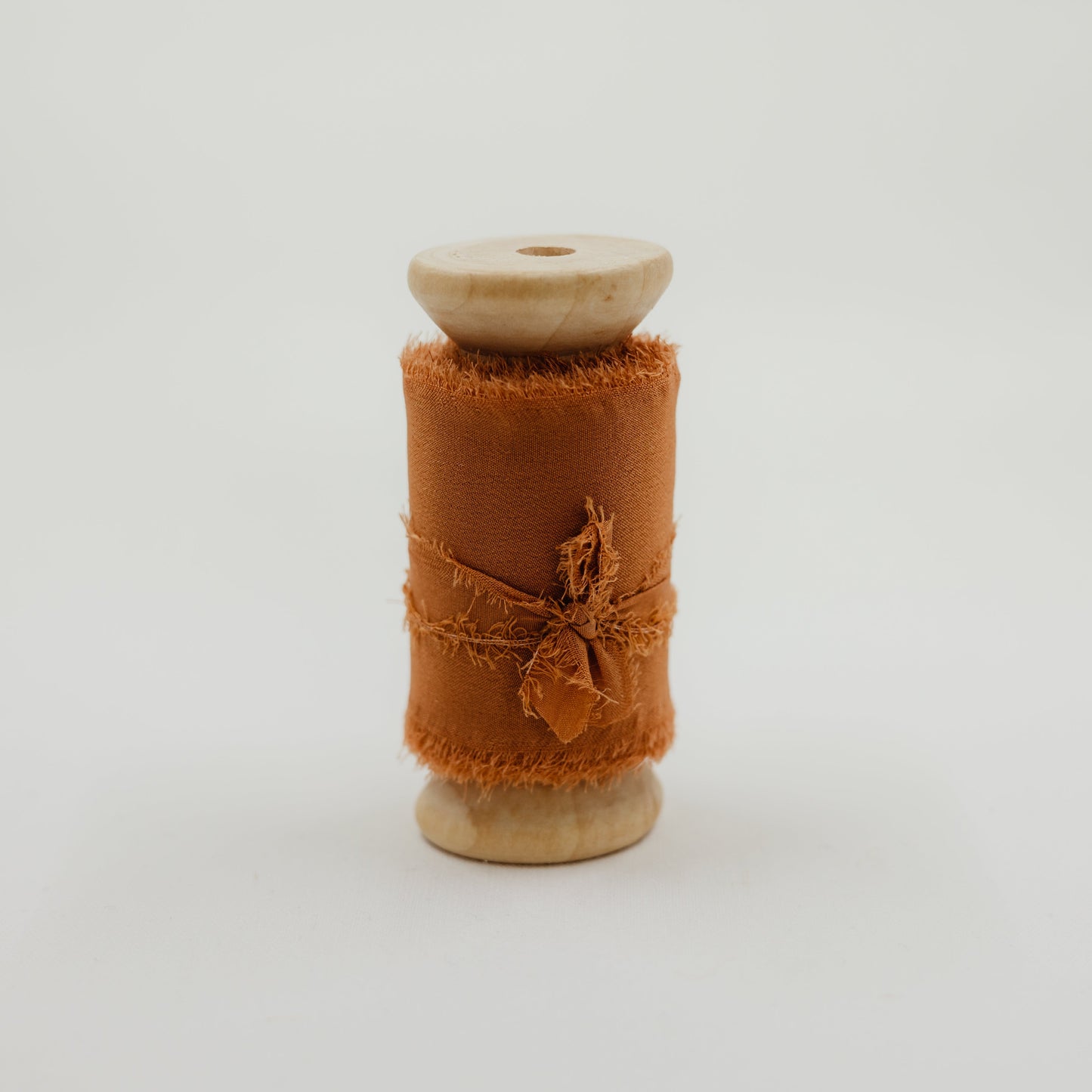 Rust color raw edge silk ribbon for wedding details and decorating invitation suite