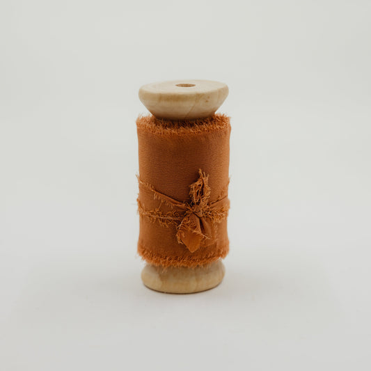 Rust color raw edge silk ribbon for wedding details and decorating invitation suite