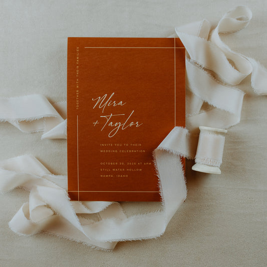 Handmade silk ribbon with a naturally frayed raw edge, used for invitation styling and flat lay photography
